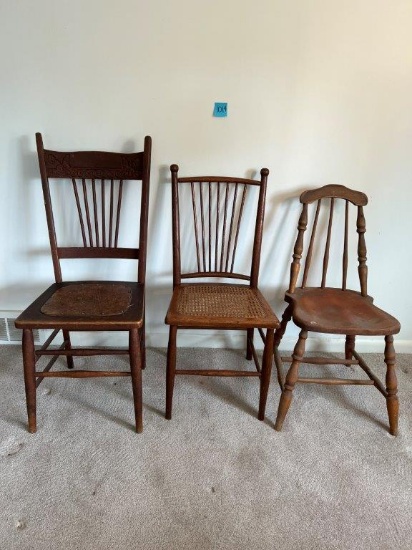 3 Spindle Back Wood Chairs, 1 has "caned" woven seat