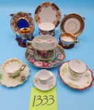 7 Painted Teacups and Saucers