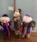 Three Large Santa Figures With Purple Coats