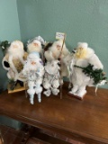 Collection Of White Christmas Santa Display Figurines