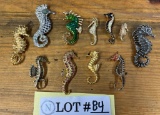 A Herd Of Vintage Seahorse Pins In Various Styles