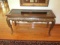 Ornate Sofa Table w/ 2 glass pane top & ornate carved Provincial style legs & front.50