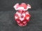 Fenton cranberry opalescent bud vase w/heart design & scalloped edge. 4.5