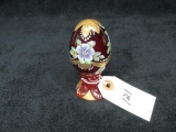 Fenton hand painted ruby red glass egg w/florals. Signed - T. Deuley, #619/3000, 3.75