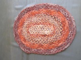 Oval braided rugs - earth tones. 42