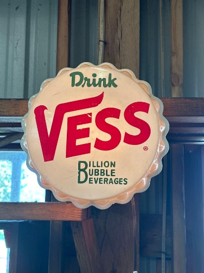 plastic Vess soda bottle top sign