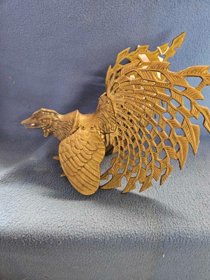 Brass gamecock.