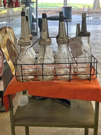 miscellaneous glass oil bottles with caps and basket