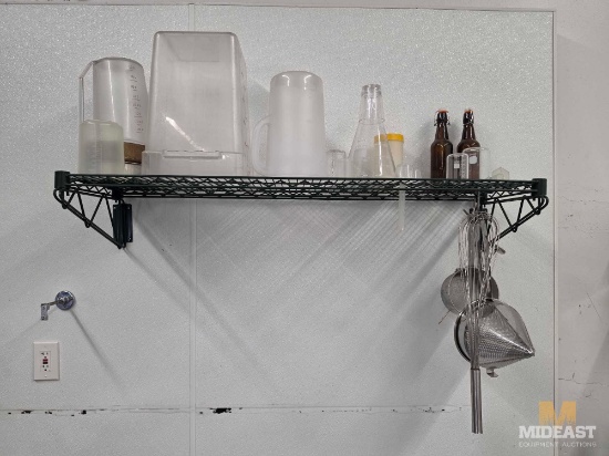 Miscellaneous Shelf of Measuring Cups, Containers, Whisks