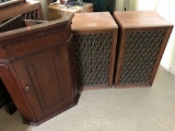 Two speakers, wooden corner cabinet