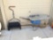 Grass seeder and metal wheelbarrow
