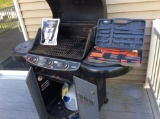 Coleman gas grill with toolset