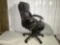 Swivel office chair in brown leather type upholstery