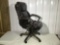 Swivel office chair and brown leather type upholstery