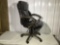 Swivel office chair in brown leather type upholstery