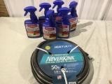 Six cans rose and flower insect killer and 50 foot hose