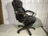 Swivel office chair in brown leather like finish