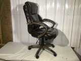 Swivel office chair in brown leather type upholstery