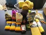 Bucket with sponges and car items and towels and sponges