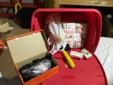 Tote with lid loaded with tissues, ratchet straps and plastic corn