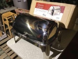 Stainless steel roll top warming chafer.