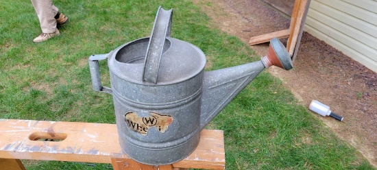 large galvanized sprinkling can