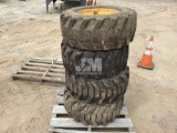 QTY OF (4) SKID STEER TIRES W/ RIMS