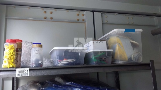 SHELF OF MISC CABLES & TENT SPIKES/ SHELF NOT INCLUDED