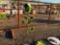 METAL 'JOHN DEERE' BIRDHOUSE ON STAND