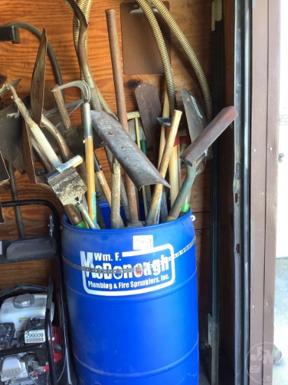 DRUM OF SHOVELS , RAKE, SCRAPPER, ETC