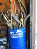 DRUM OF SHOVELS , RAKE, SCRAPPER, ETC