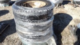 QTY OF (4) FIRESTONE 10.00-20 TIRES, W/ WHEELS