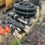 LOT OF MISC SIZED WOODEN STAKES AND PLASTIC TUBING