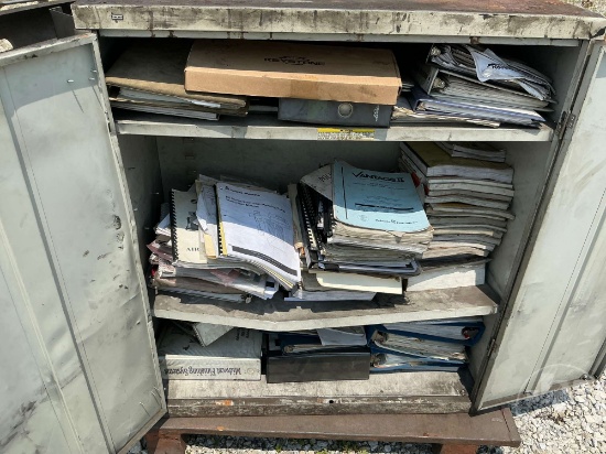 CABINET WITH OWNER MANUALS AND MISC