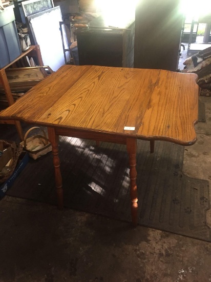Solid Oak double drop leaf table. Small perfect size for many uses