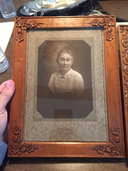Two antique photos in carved wooden frames