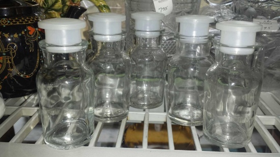Lot of (5) T.C.W. Co. glass apothecary-type bottles with plastic Stoppers