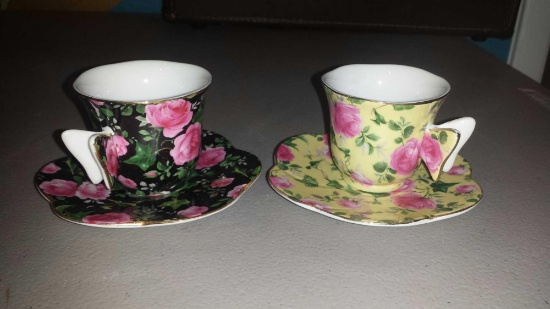 Pair of Simply Precious Unmatched Flower Teacups and Saucers with butterfly handles