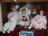 (4) Shelf Sitting Porcelian Dolls 