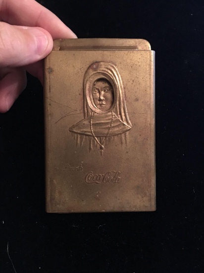 Brass Coca Cola buckle nun with slide out nude.