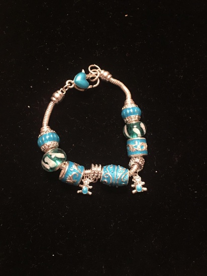 Pandora style charm bracelet with charms. Unknown maker