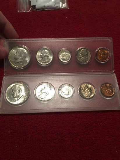 Two 1964 uncirculated US coin sets. In cases