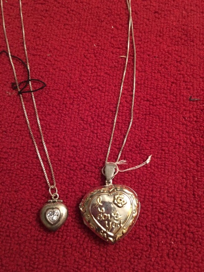 Two Sterling necklaces with sterling heart lockets.