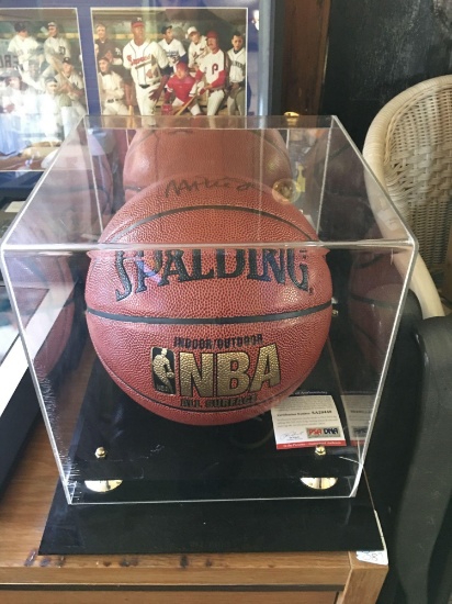 Magic Johnson signed Spaulding basketball with PSA authentication in display case