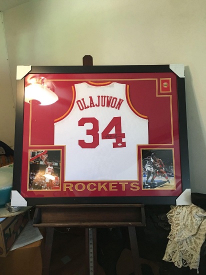 Stunning autographed Hakeem Olajuwon jersey framed and matted With photos including Shaq