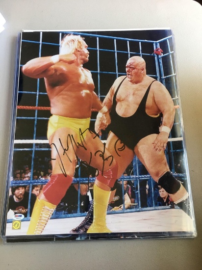 Fabulous Autographed photo/poster of Hulk Hogan and King Kong Bundy in a cage match.