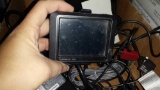 Garmin Nuvi GPS with stand, chords, plugs and more