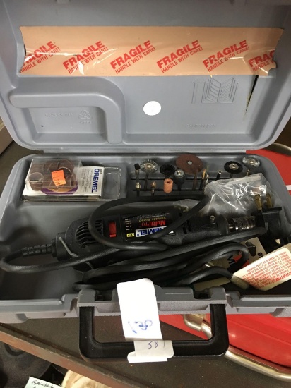 Dremel tool in hard case with attachments