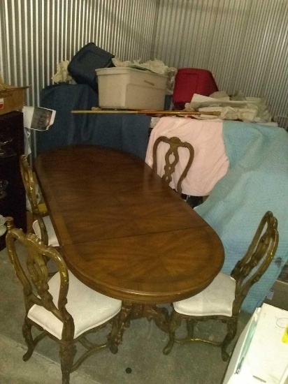 Very large 3 leaf dinning room table and 4 chairs