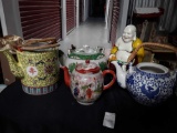 4 Asian teapots and (non ceramic) buddha sculpture